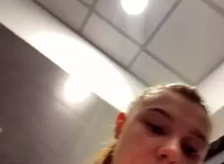 The amateur teen casually fingered her wet pussy in a public outdoor spot.