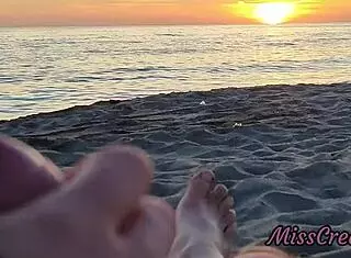 Flashing my cock in front of my stepdaughter at sunset in a public beach and she helps me cumshot in front of everyone - real sex risky