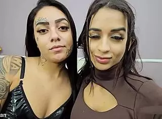 two curvy latina babes start with sweet kisses then dive into passionate lesbian action on the bed