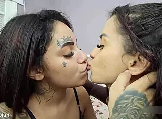 two curvy latina babes start with sweet kisses then dive into passionate lesbian action on the bed