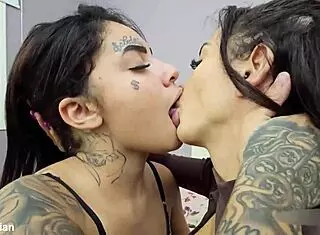 two curvy latina babes start with sweet kisses then dive into passionate lesbian action on the bed