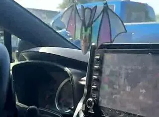 just a girl trying to adjust her sports bra properly in the gym parking lot