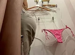 Hey, check out this hot slut caught trying on a bikini with perfect tits and big ass