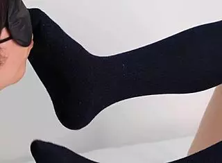 Hey, check out this cute Japanese girlfriend in uniform giving footjob with socks.