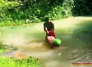 Hey, watch this hardcore bang with an African whore riding my big dick in the stream, she gets a wet pussy creampie