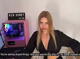 Blonde girl teases seductively on camera outdoors with panties showing.