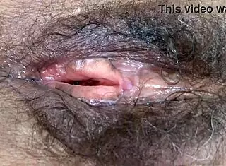 Big hairy pussy after intense fucking session filled with hot cum inside