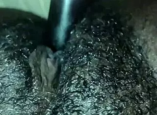 so this ebony chick starts playing with her wet hairy pussy at home. she rips clothes for solo orgasm in dripping beaver action.