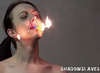 Emily T tied in garage as brutal master punishes slave with burning facial