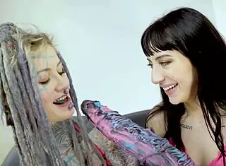 Tattooed goth teen gapes ass with huge anal toy