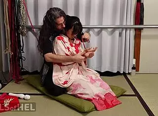 Rope-Suspended Asian Babe Teases With Pussy Clamps