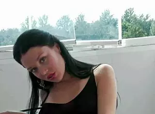 wanna watch this exhibitionist brunette finger her pussy on the balcony??