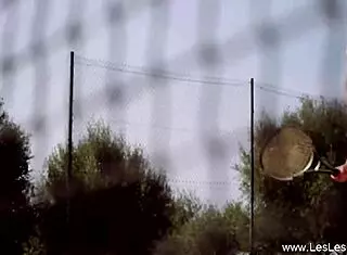 At the court, she casually licked her mature blonde partner's pussy while fingering.