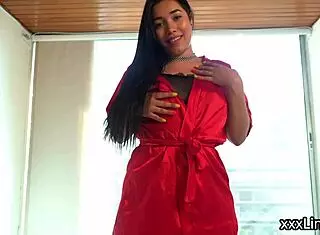 She fingers herself in the living room to a long orgasm.