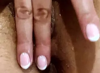 Oiled wife masturbates to squirting climax