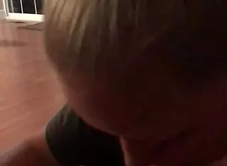 wife eagerly sucking her husband's big cock in the bedroom, teasing with her tongue