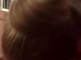 wife eagerly sucking her husband's big cock in the bedroom, teasing with her tongue