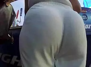 Beautiful brunette walks excitingly through the scene