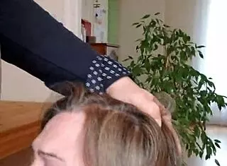 female slave performs blowjob in submission