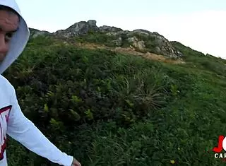 young girl giving blowjob on rocks by the sea