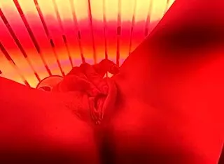 Redhead Gets Off In Public Tanning Bed With Voyeur Watching