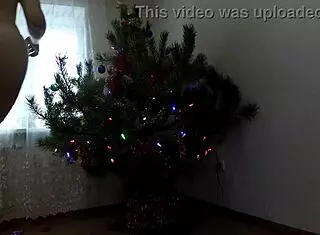 Bitch dancing around the christmas tree, then solo pussy play.