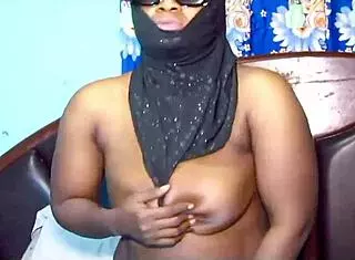 Hijab milf teases with big tits and spreads legs 😏