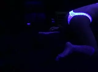 Scarlett Johnson Engages in Blacklight Sex with Fetish Elements