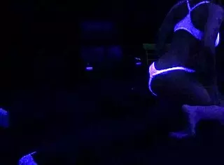Scarlett Johnson Engages in Blacklight Sex with Fetish Elements