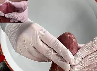 Patient POV: White latex gloves give close-up handjob on glans in medical water features