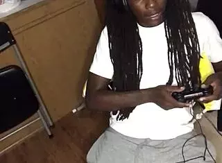 ebony girl gives detailed blowjob to black guy while he's gaming
