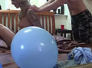 milf gives a sensual massage to her step daughter in the bedroom with balloons