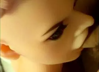 The sex doll is sucking my cock so well