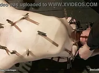 bound slave clamped in metal body for rough deepthroat gagging