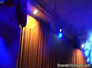 Blonde performs sexy lapdance on public stage, clothes ripped in group orgy.