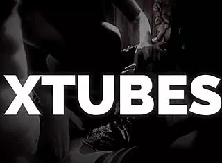 Torment of a slave on the St. Andrew's cross by mistress in leggings and hot boots with clamps