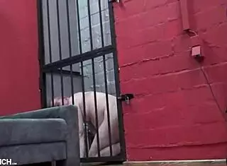 Torment of a slave on the St. Andrew's cross by mistress in leggings and hot boots with clamps