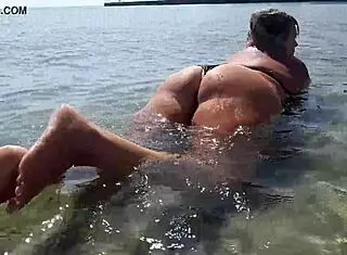 Wet big boobs get attention with hot sucking toy in public