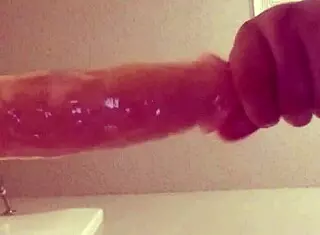 gay guy teasingly tries fitting a large dildo into his ass