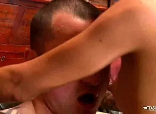 Pawn shop owner negotiates a deal with a brunette in his office