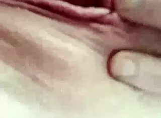 alura marie baker looks horny as she plays with her tits and pussy.