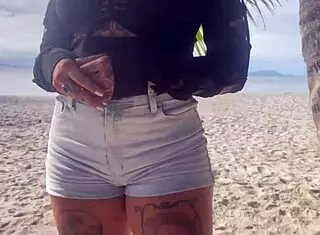 Bold shibari bondage exposes small tits in public outdoor setting