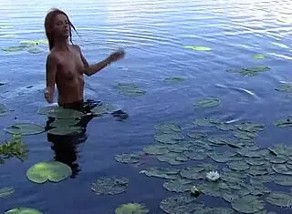 naked redhead teen toys with water lily so casually