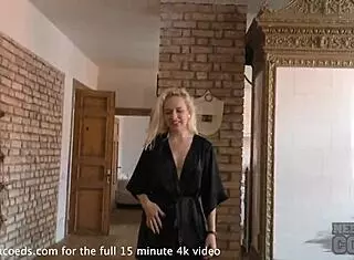 Pretty blonde hair dresser stretches naked on sofa
