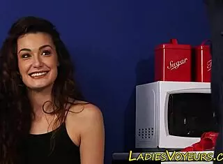 Clothed brunette watches the horny babe next door.