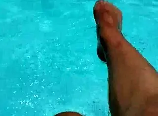 feet in the pool with a lot of water, young 18+ amateurs enjoying the moment