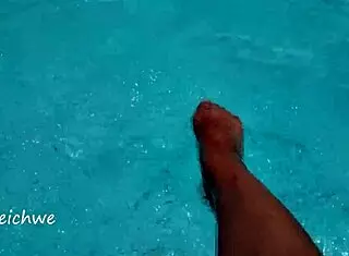 feet in the pool with a lot of water, young 18+ amateurs enjoying the moment