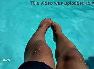 feet in the pool with a lot of water, young 18+ amateurs enjoying the moment