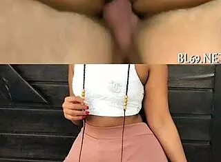 Model Phumla poses in bikini by the pool, showcasing her figure outdoors