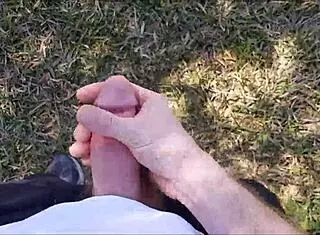 Hairy guy jerks off in public bush